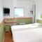 Hotel ibis budget Flers Grands Champs : photos des chambres