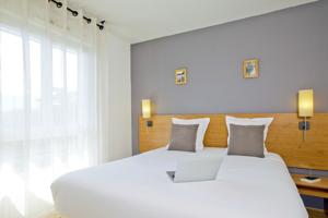 Hebergement Sejours & Affaires Annecy Le Pont Neuf : photos des chambres