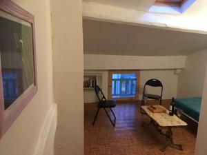 Hebergement Entre l'eglise et la place : photos des chambres