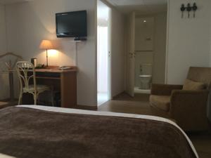 Nouvel Hotel du Commerce : photos des chambres
