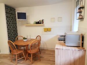 Appartement Aux pieds des thermes : photos des chambres