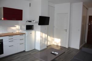 Appartement Cosy Apartment : photos des chambres