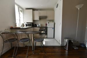Appartement Studio Saint Louis : photos des chambres