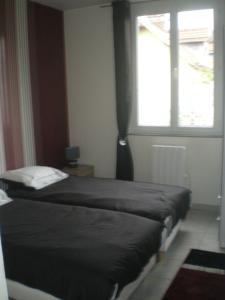 Appartement Quatre a troyes : photos des chambres