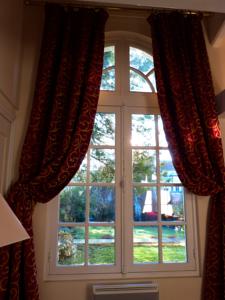 Appartement L'Orangerie White-Palacio : photos des chambres