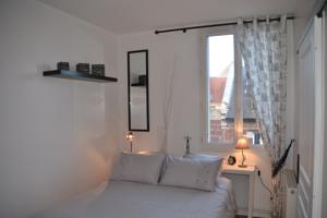 Appartement Le petit Paris : photos des chambres