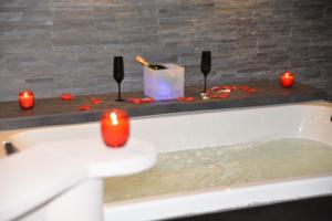 Appartement Loft avec spa privatif : photos des chambres