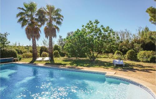Nice home in St Pons de Mauchiens with 4 Bedrooms, WiFi and Outdoor swimming pool : Maisons de vacances proche de Cazouls-d'Hérault