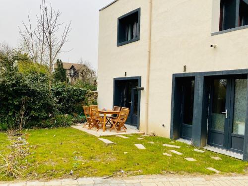Duplex avec poêle et jardin : Appartements proche de Saint-Brice-sous-Forêt