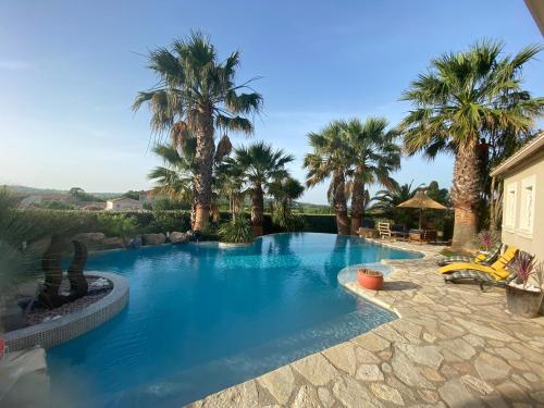 KABEN Superbe villa prestige 4etoiles, piscine chauffée, sauna, jacuzzi, pétanque : Villas proche de Puissalicon
