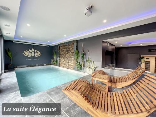 Chambre avec spa, piscine et sauna privatif : B&B / Chambres d'hotes proche de Brêmes