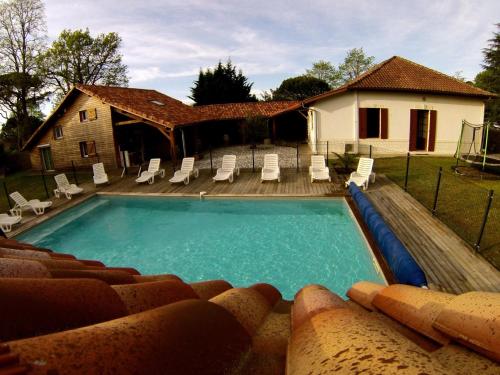 Ensemble de 3 villas avec piscine chauffée, esprit détente : Maisons de vacances proche de Sanguinet