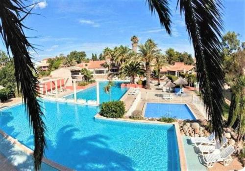 Charmant appartement avec piscine dans un village vacance : Appartements proche de Canet-en-Roussillon