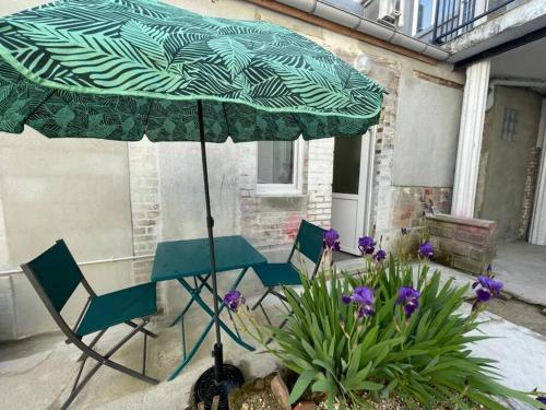 Studio climatisé avec extérieur : Appartements proche de Courtois-sur-Yonne