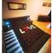 Appartements le tricosy jacuzzi et sauna privatif : photos des chambres