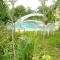 Maisons de vacances Maison de 4 chambres avec piscine partagee jardin clos et wifi a Sarrazac : photos des chambres