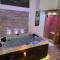 Appartements Le Cosily jacuzzi et sauna privatif : photos des chambres