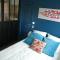 Maisons d'hotes Studio Cosy proche Grand-Champ Home Sweet Home : photos des chambres