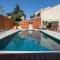Villas Superbe maison avec piscine : photos des chambres