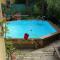 Maisons de vacances Pavillon dans un ecrin de verdure avec piscine : photos des chambres