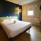 Hotels Ibis Budget Chalon Sur Saone Nord : photos des chambres